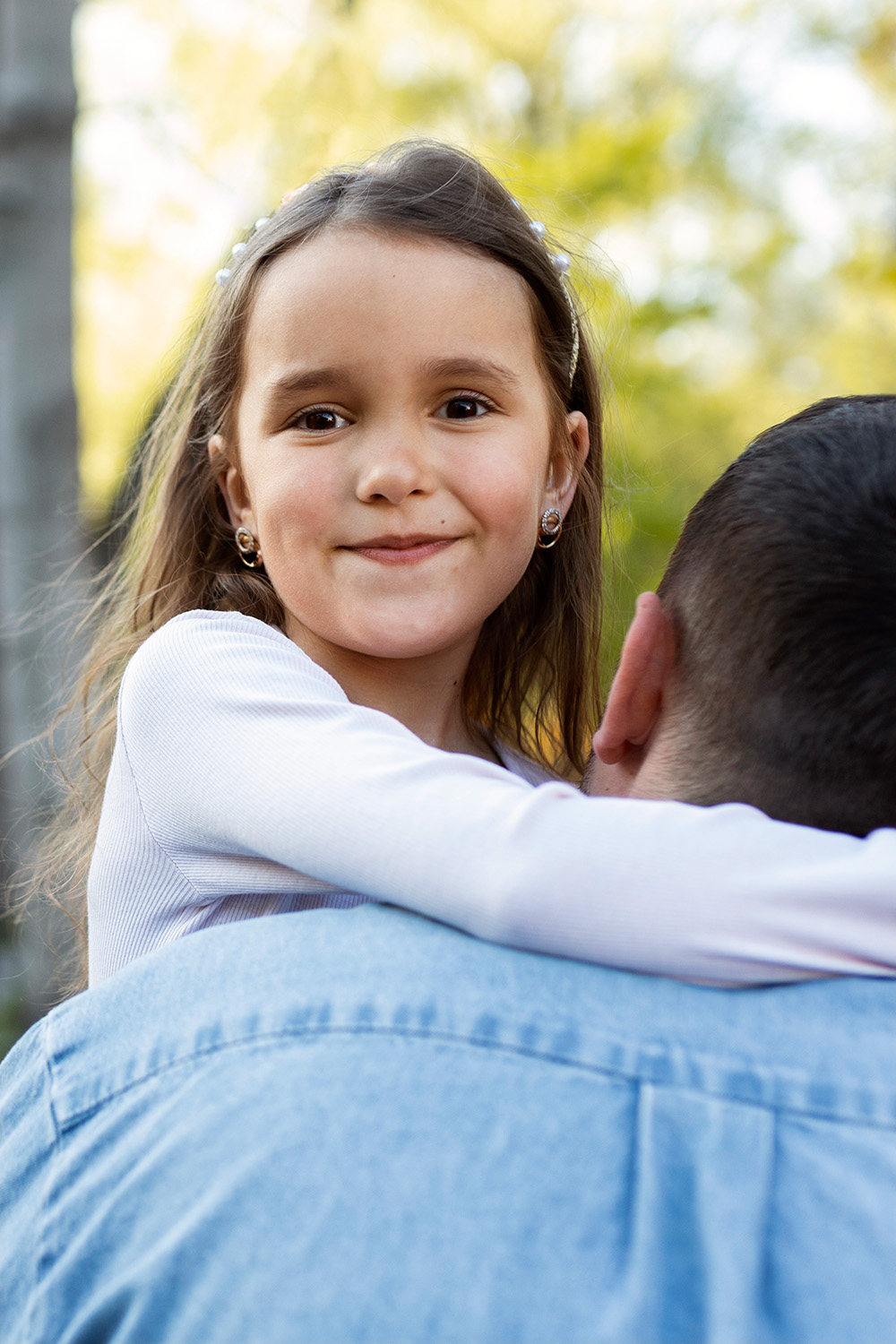 father holding daughter